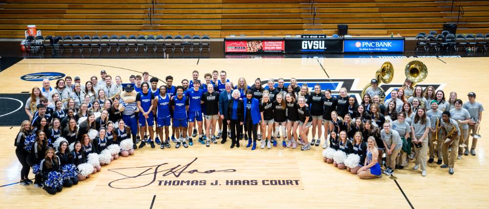 Group photo over signed court